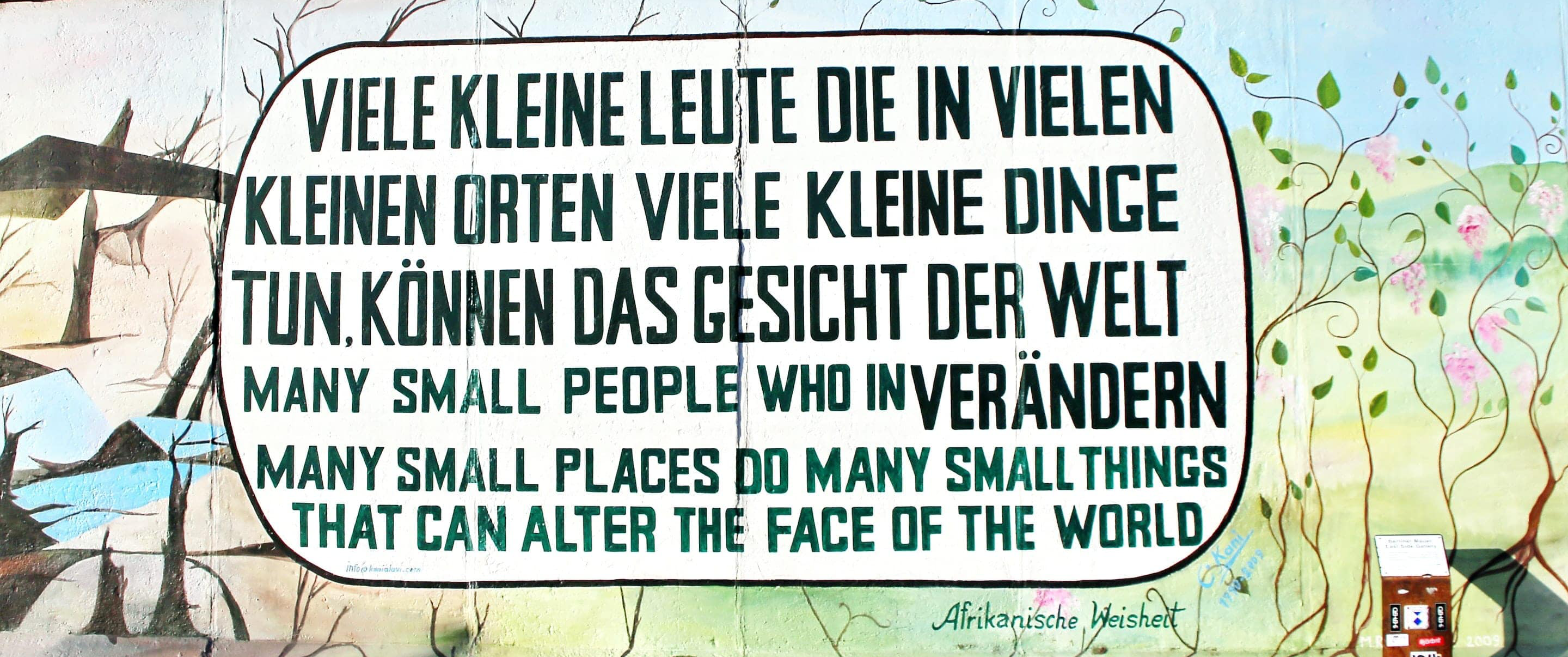 many small people who in many small places do many small things that can alter the face of the world mural