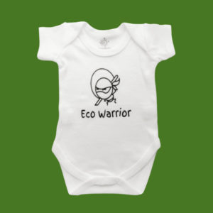 White baby short sleeve bodysuit with the words eco warrior and a picture of a ninja warrior printed on the front, set on a green background